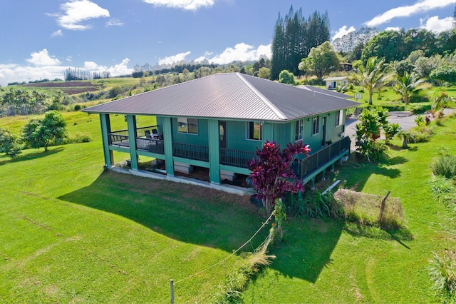 rear view of house with a lawn