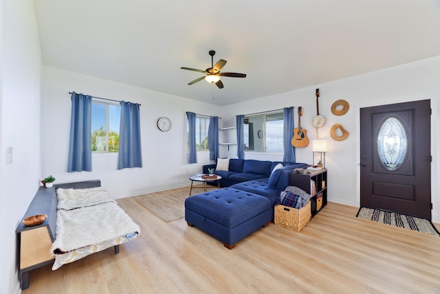 living room with hardwood / wood-style flooring and ceiling fan