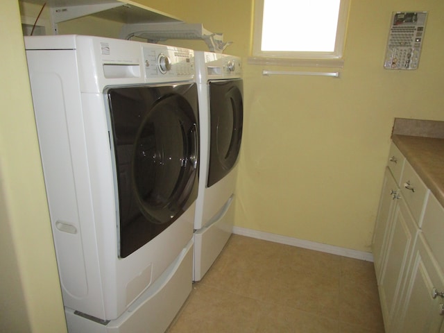 clothes washing area featuring washer and dryer