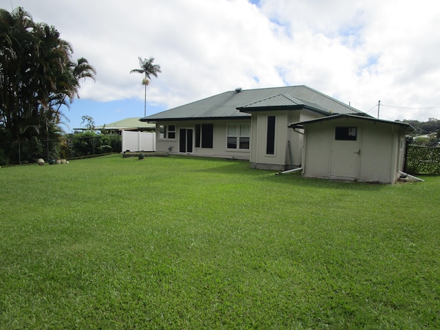 back of house featuring a yard