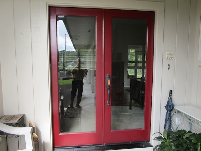 view of exterior entry featuring french doors