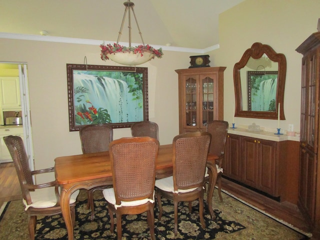 dining area with crown molding