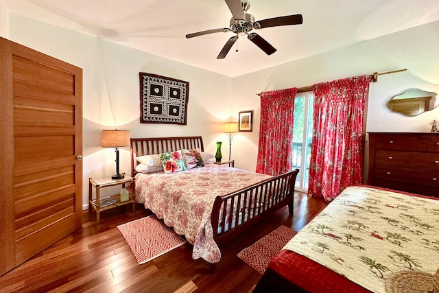 bedroom with dark hardwood / wood-style floors and ceiling fan