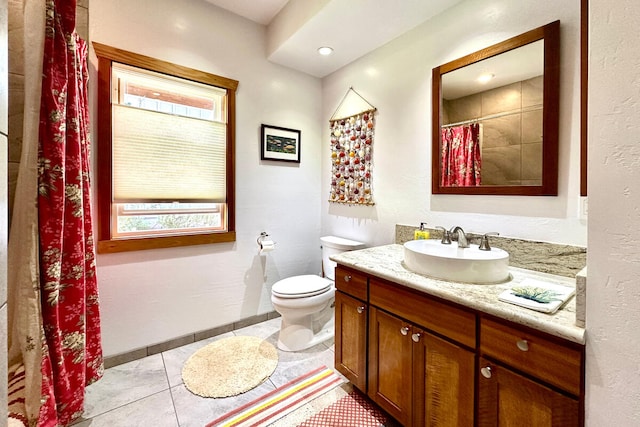 bathroom with tile patterned floors, vanity, and toilet