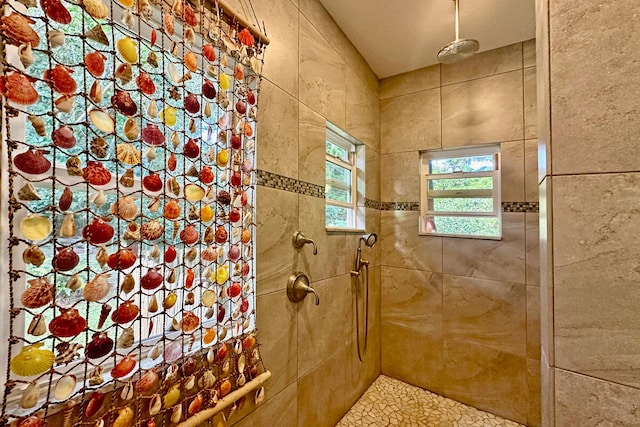 bathroom with tiled shower