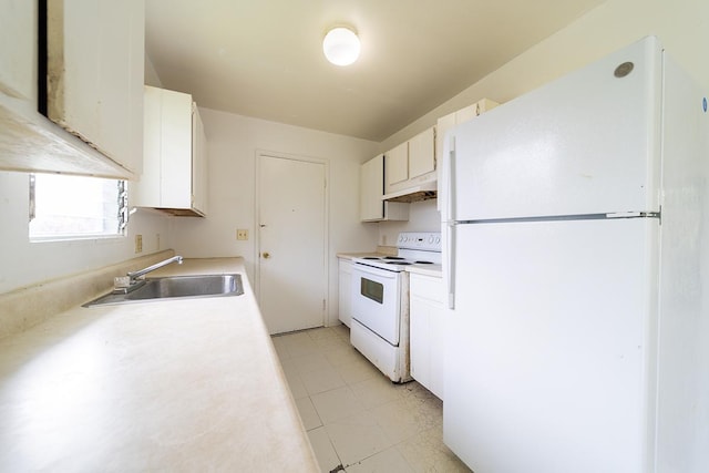 kitchen featuring white cabinets, sink, and white appliances