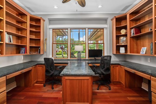 home office featuring dark hardwood / wood-style flooring, built in desk, and ceiling fan