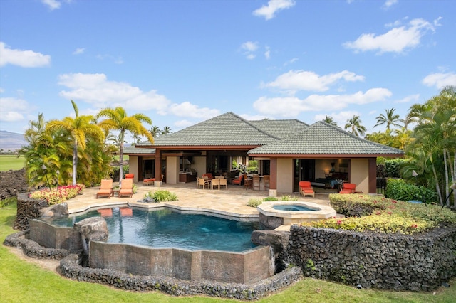 view of swimming pool with an in ground hot tub, outdoor lounge area, and a patio