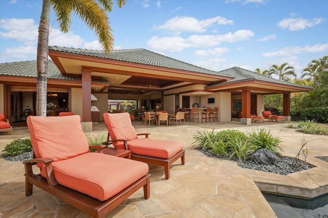 view of patio / terrace featuring an outdoor bar