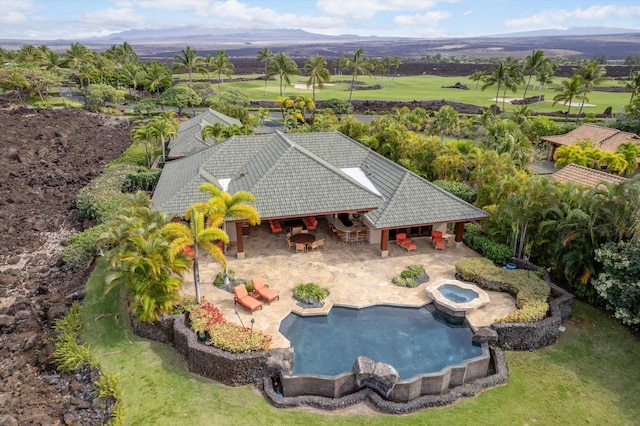 view of pool with a patio and an in ground hot tub