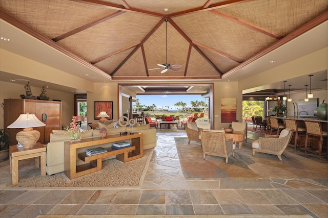 living room with ceiling fan, wooden ceiling, and high vaulted ceiling