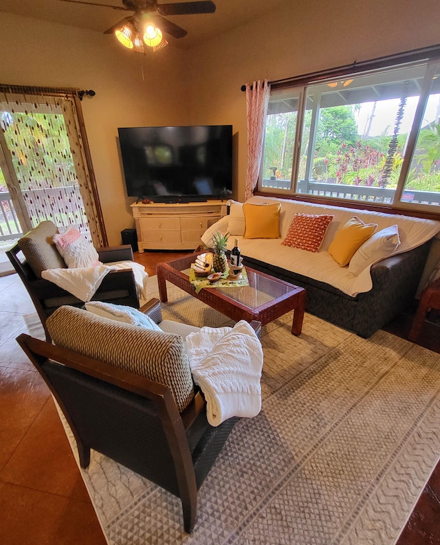 tiled living room with ceiling fan