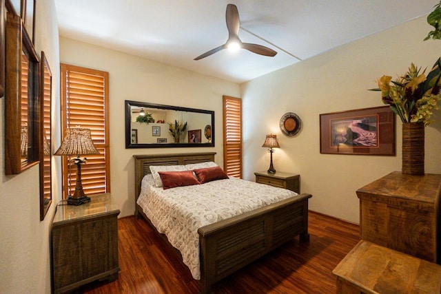 bedroom featuring ceiling fan and dark hardwood / wood-style flooring