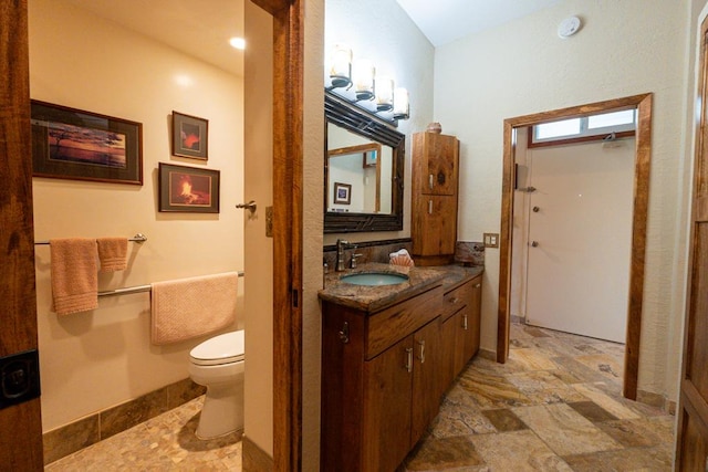 bathroom with toilet and vanity