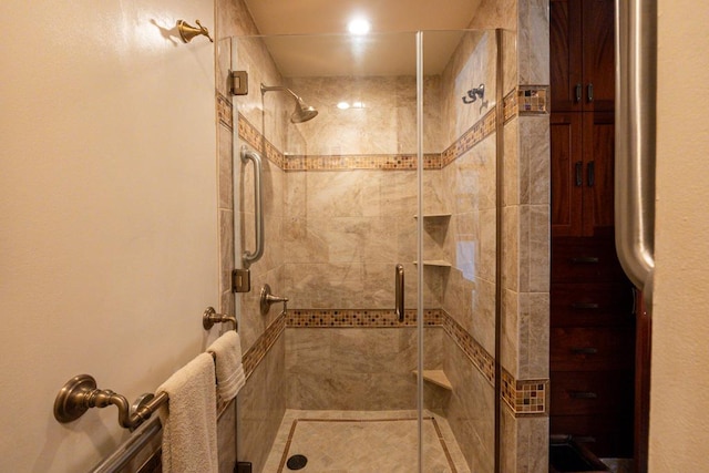 bathroom featuring an enclosed shower