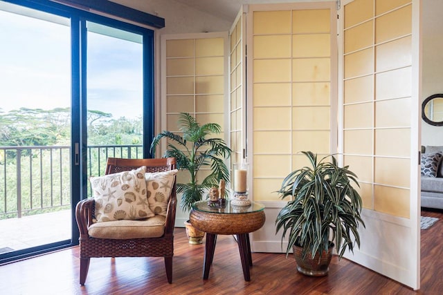 living area featuring hardwood / wood-style floors and plenty of natural light