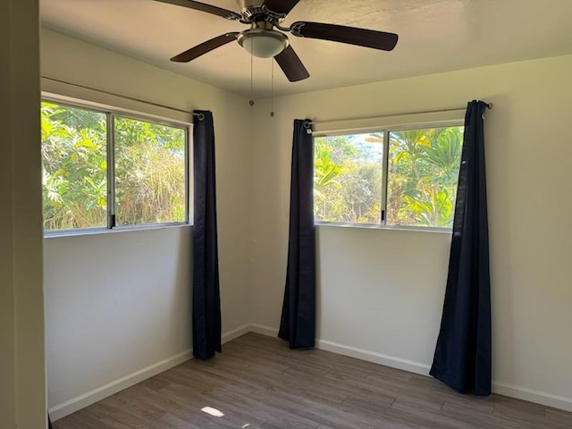 spare room with light hardwood / wood-style floors and ceiling fan