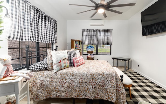 bedroom featuring ceiling fan and a wall mounted AC