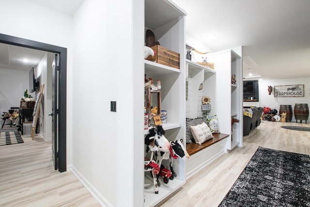 mudroom with light hardwood / wood-style flooring