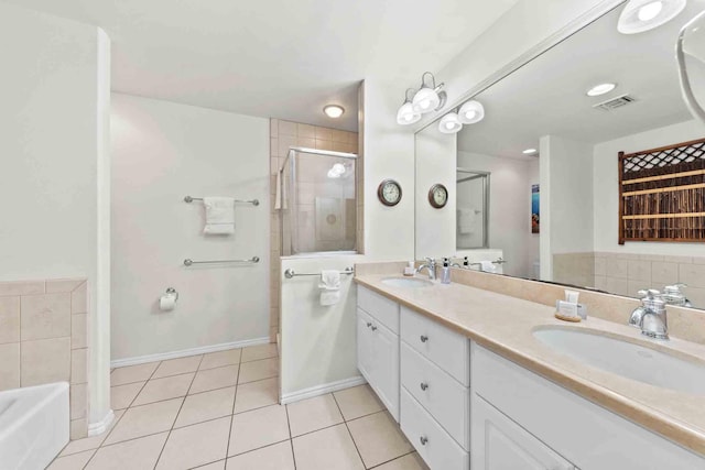 bathroom with tile patterned floors, vanity, and independent shower and bath