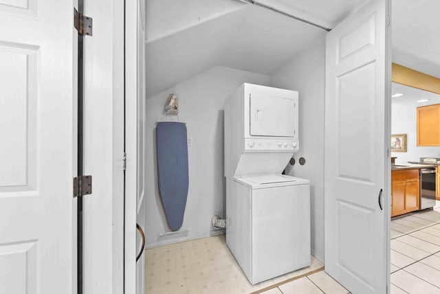 laundry area featuring stacked washer and dryer