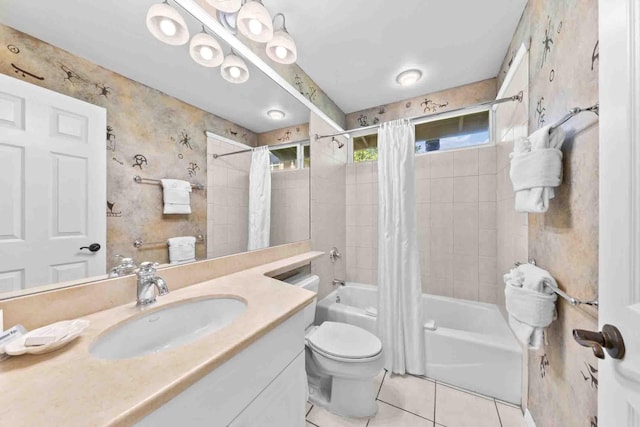 full bathroom featuring tile patterned floors, vanity, toilet, and shower / bathtub combination with curtain