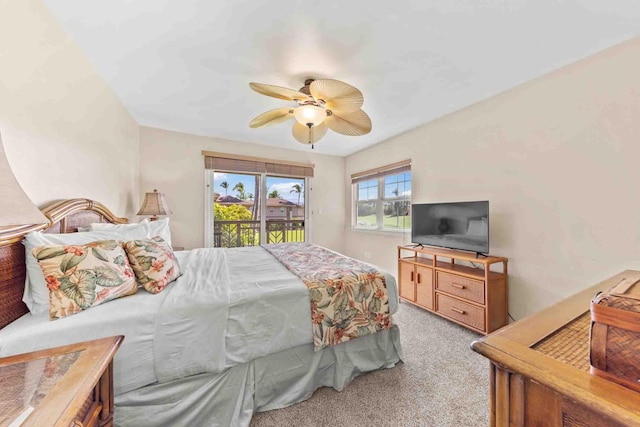 bedroom featuring ceiling fan, light colored carpet, and access to outside