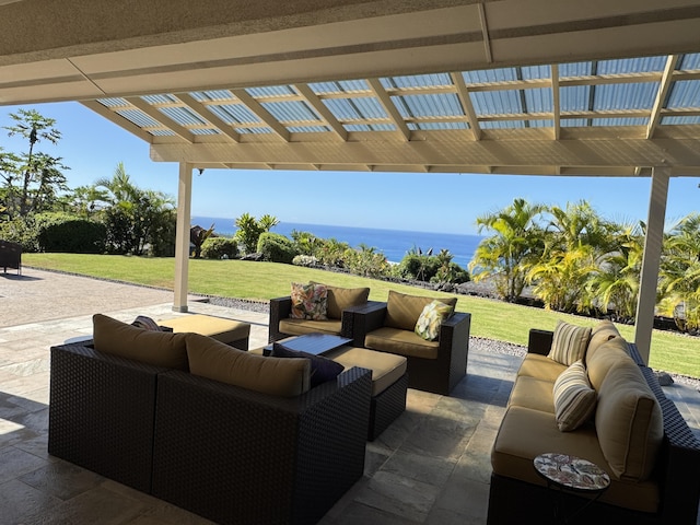 view of patio featuring a pergola, an outdoor living space, and a water view