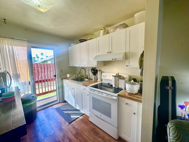 kitchen with dark hardwood / wood-style floors, white cabinetry, butcher block counters, and white electric range