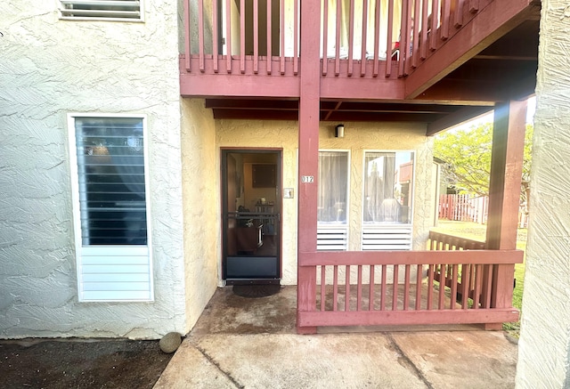 entrance to property with a balcony