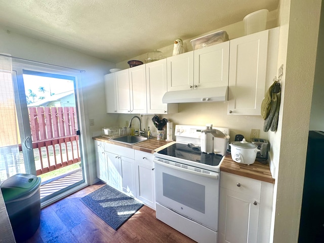 kitchen with a textured ceiling, white range with electric stovetop, sink, white cabinetry, and butcher block counters