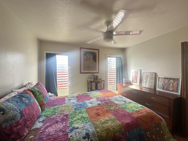 bedroom featuring a textured ceiling and ceiling fan