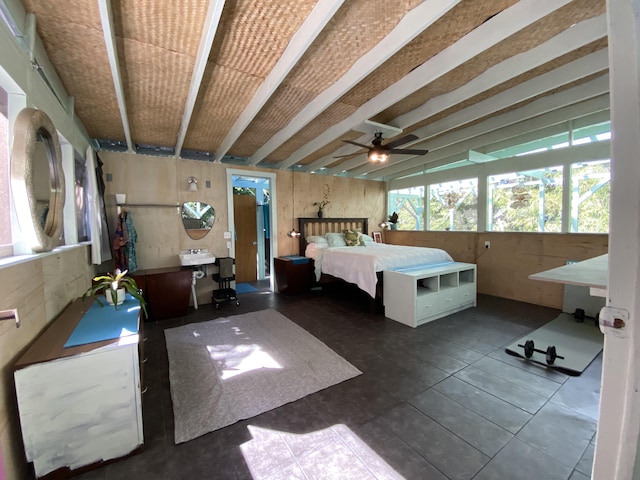 bedroom featuring ceiling fan and vaulted ceiling