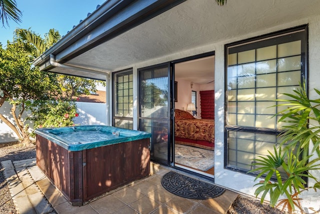 view of patio / terrace with a hot tub