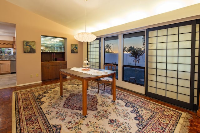 dining space with lofted ceiling