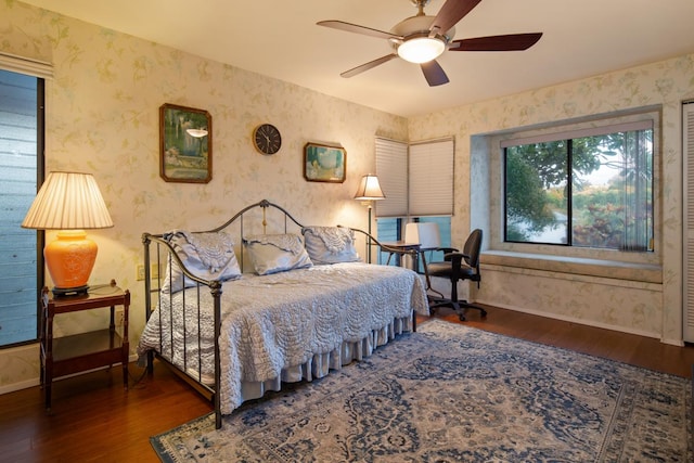 bedroom featuring ceiling fan and dark wood-type flooring