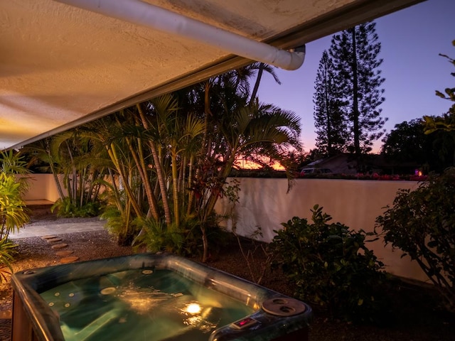 exterior space featuring a hot tub