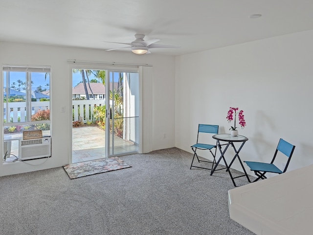 unfurnished room featuring ceiling fan and carpet floors