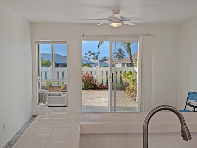 doorway featuring ceiling fan, cooling unit, and a mountain view