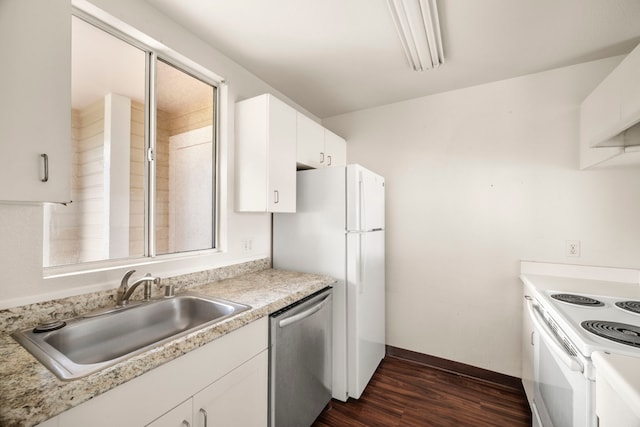 kitchen featuring dark hardwood / wood-style floors, white cabinetry, sink, and white appliances