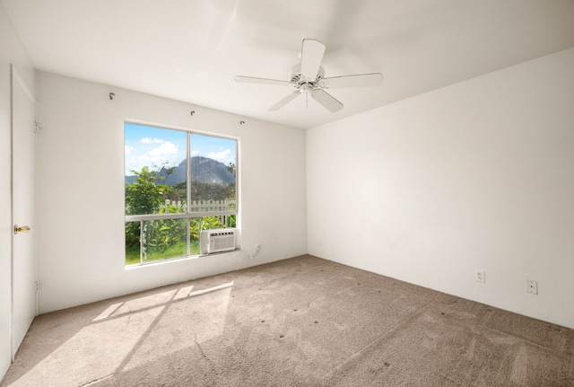 unfurnished room featuring cooling unit, ceiling fan, plenty of natural light, and carpet