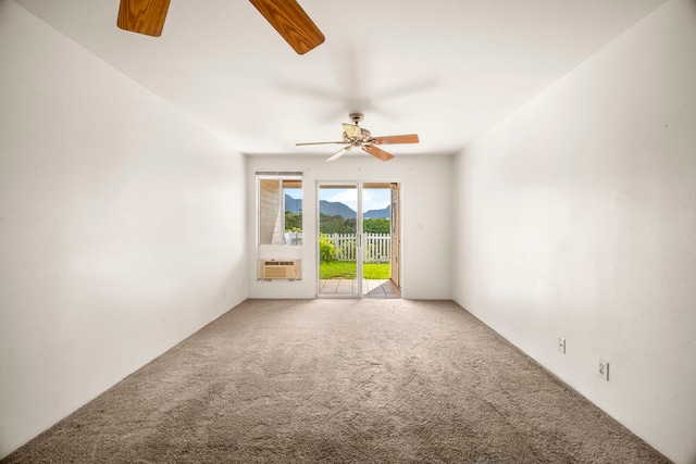 carpeted empty room with cooling unit and ceiling fan