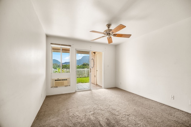 unfurnished room featuring carpet and ceiling fan