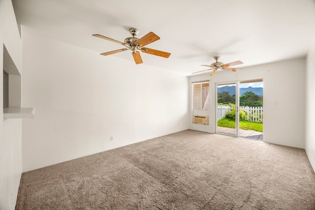 unfurnished room featuring carpet floors, cooling unit, and ceiling fan