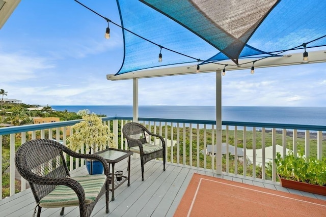 wooden deck featuring a water view