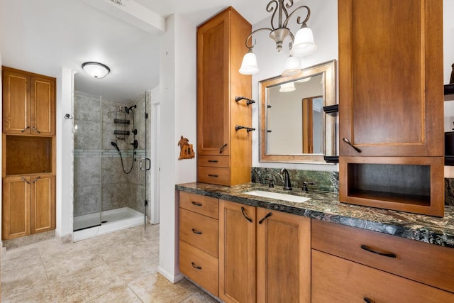 bathroom featuring an enclosed shower and vanity