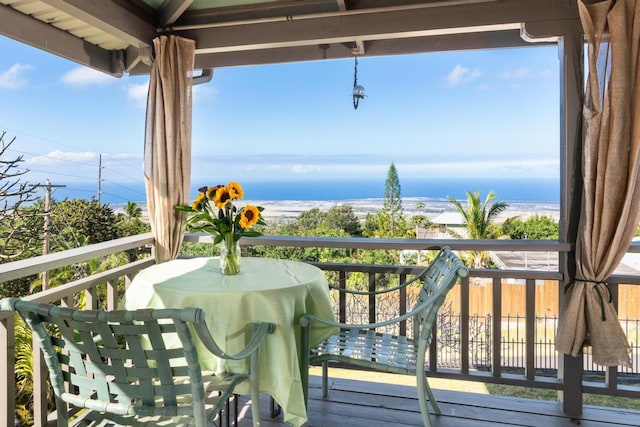 balcony featuring a water view