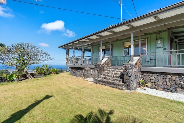 exterior space with a front lawn and a porch