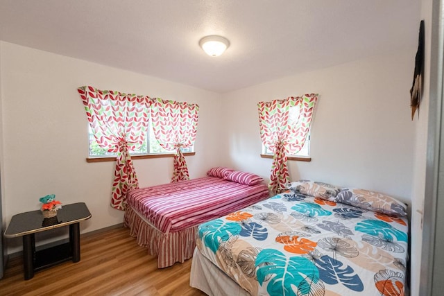 bedroom featuring wood-type flooring