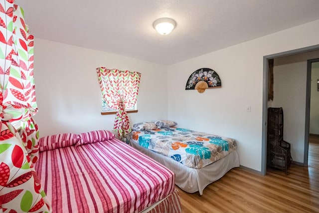 bedroom featuring wood-type flooring